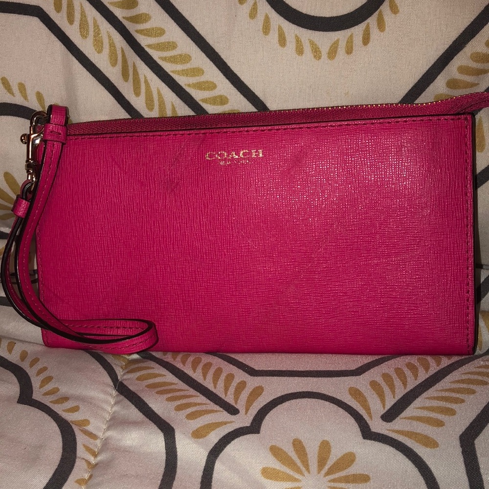 Pink coach clutch